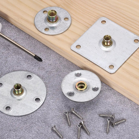 Rock Solid M8 Brad Hole T Nuts With Heavy Duty 2.8 Inch Round Base Weld Nuts and screws on a surface, ideal for woodworking and repairs.
