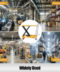 Solid Frame Hydraulic Scissor Lift Table Cart With Five Hundred Pound Capacity And Four Quiet Rollers shown in factory, supermarket, warehouse, cold store setting.