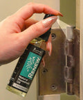 Hand using Renew Natural Household Oil Unscented All Purpose Lubricant Spray For Doors Hinges And Locks Eco Conscious Safe For Pets