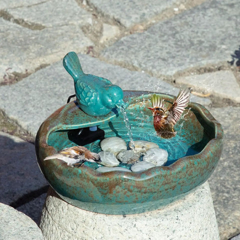 Solar Powered Bird Bath Fountain With Battery Backup For Outdoors, ceramic bowl on pedestal with birds near water.