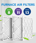 Three furnace air filters with MERV 8, 11, and 13 ratings displayed indoors with flowing green leaves.