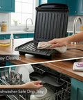 Ovente Two Serving Electric Indoor Grill And Panini Press Compact Contact Maker For Juicy Steaks Bold Smoky Flavor No Outdoor Mess Black Kitchen Appliance being cleaned with a cloth on a countertop.