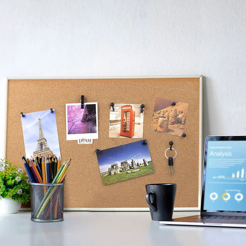 Top Tier Black Push Pin Set With Five Fresh Thumb Tacks And Sharp Steel Point Map Pins For Heavy Duty Cork Board Organization Rock Solid 140 Piece Desk Kit displayed on a cork board with photos.