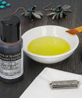 Front view: Beadsmith XL Liver of Sulfur Extended Life Gel bottle (1 oz) with yellow patina in bowl