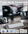 Rock Solid Aluminum Wireless Mechanical Gaming Keyboard With Dedicated Numberpad Featuring Tri Mode Bluetooth And Usb Wired Connection For Zero Lag Action And Butter Smooth Typing On Windows Mac And Tablets on a desktop with monitors and devices.