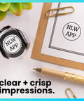 Self Inking Inspection Stamp Dual Line Layout For Swift Quality Control Checks shown with clear imprint on paper.