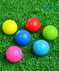 Six Pack Colorful Golf Balls Gift Set For Practice And Training Bright Blue Green Red Yellow on grass