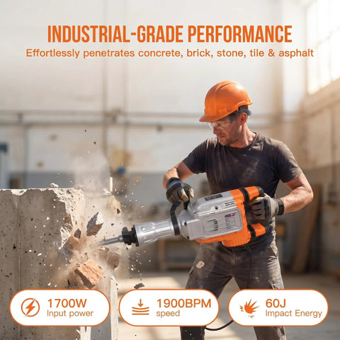 1700W Electric Jackhammer Concrete Breaker With 1900 BPM Demolition Power And Complete Three Piece Chisel Set Including Pointed And Wide Flat Bits For Heavy Duty Construction Tasks And Rocky Terrain Projects Badass Performance For Pros used by a worker to break concrete.