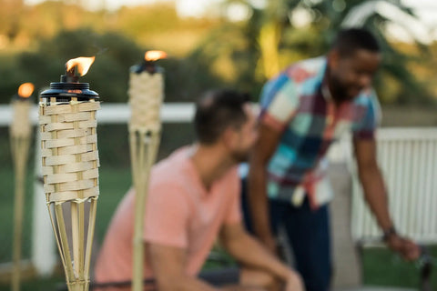 Easy Pour 12 Pack Bamboo Torch Set With Classic Weave Brown Finish Outdoor Lawn Patio Garden Lighting in use