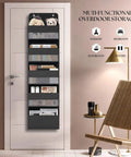 Over Door Organizer With Five Extra Large Pockets Heavy Duty Hanging Storage in black on a white door next to a chair.
