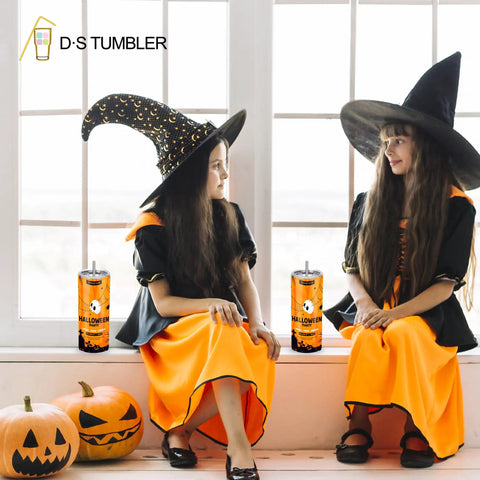 Two girls in witch costumes with Halloween-themed cups from a 50 pack 20 Oz white sublimation tumblers with individual gift boxes.