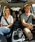 12V And 24V Car Kettle Heats Fast Stainless Steel Travel Mug For Sedans positioned in a car holder with family during a trip.