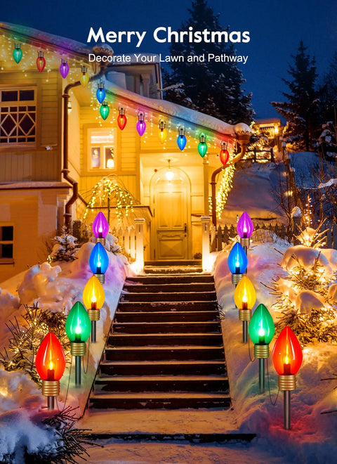 Two Pack Jumbo C9 Christmas Pathway Lights For Outdoor Decor, 17 Feet Total With Ten Multicolor LED Bulbs, Stakes Included, seen along a snow-lined pathway.