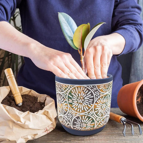 Person planting in Three Piece Ceramic Plant Pots Set With Drainage Holes, 5.7 4.7 3.5 Inch, Dope Modern Blue Indoor Outdoor Planters.