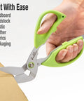 Person using Beefy Heavy Duty Multipurpose Angled Craft Scissors 7 Inches With Japanese Stainless Steel Serrated Blade for cardboard.