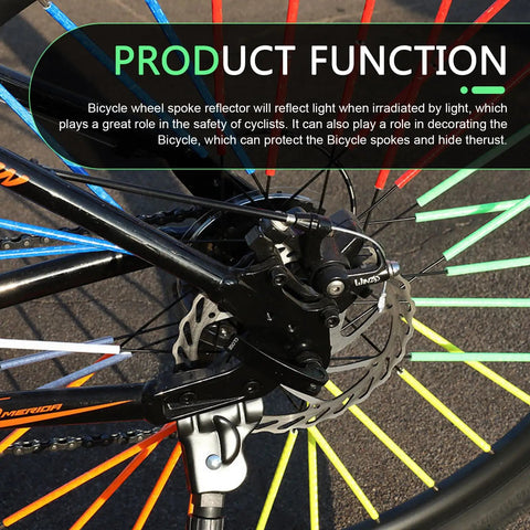 Close-up of a bike wheel with a Multicolor 72 Piece Bicycle Spoke Reflectors Kit With 360 Degree Visibility For Night Riding Reflective Stickers.