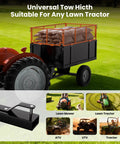 Beefy Heavy Duty Steel Dump Cart With 17 Cu Ft Bed 750 Lb Capacity attached to tractor on lawn