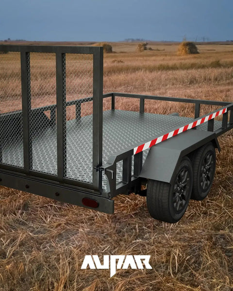 Rear view of a steel trailer with Heavy Duty Steel Trailer Gate Spring Latch Repair Kit 819T Anti Rust Black gate installed, outdoors.