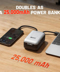 Portable device functioning as a 25,000mAh power bank, charging a smartphone and laptop on a wooden table.