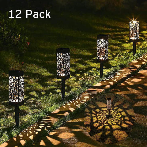 12-pack decorative path lights glowing at night along garden edge, Solar Pathway And Garden Lights 12 Pack LED Auto On At Night Auto Off At Dawn