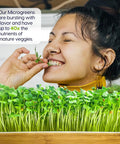 Woman enjoying fresh microgreens grown with Self Watering Microgreens Kit For Indoor Growing, Reusable Tray With Grow Mats
