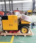 Compact Mini Concrete Pump Trailer For Shootin Smooth Mortar And Material Delivery Field Tested Gear Built For The Daily Grind No Hassle Custom Specs Ready For Quick Setup Today, side view in warehouse.