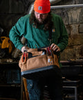 Man holding Onsite Tool Bag For Pros Built Tough Durable Water Resistant 16 Inch Heavyweight Tool Organizer with Molded Base
