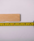 American-Made Basswood Paint Stir Sticks 21 Inch Bulk 250 Count with tape measure showing 21-inch length