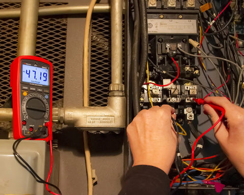True RMS 6000 Count Digital Multimeter With Low Pass Filter And NCV Detector in use, testing electrical panel voltage