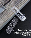 20 Pcs Clear Plastic Locking Shelf Pins 5mm 3/4 Inch Self Locking Shelf Support Peg Clips For 4.5 To 5mm Peg Holes And Slightly Larger Than 20 To 21mm Cabinet Shelves on wood surface