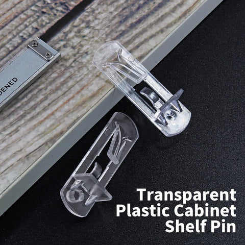 20 Pcs Clear Plastic Locking Shelf Pins 5mm 3/4 Inch Self Locking Shelf Support Peg Clips For 4.5 To 5mm Peg Holes And Slightly Larger Than 20 To 21mm Cabinet Shelves on wood surface
