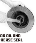 Powerbuilt seal puller in use to remove an oil/grease seal from a round bearing housing; gloved hands.