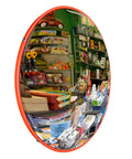 12 Inch Convex Safety Traffic Mirror Boasts Crisp Fisheye Vision For Rock Solid Garage Parking Assist Plus Driveway Blind Spot Wipeout Designed For Outdoor Indoor Install To Crush Hazards In Stores Or Tight Alleyways reflecting a colorful store interior with various products.