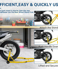 900 Lbs Front And Rear Universal Motorcycle Stand Lift For Most Sport And Dirt Bikes Yellow Portable Bike Stand With Adjustable Brackets Fits Yamaha Honda Kawasaki Suzuki BMW And More shown lifting a bike in a garage.