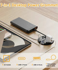 Slick Clutch Desk Power Grommet Featuring Retractable Usb C Cable, 2 AC outlets, 4 USB ports on a wooden desktop setup.