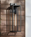 Modern Industrial Outdoor Wall Light Fixture in Mystic Black with 27 Inch Clear Glass Panels mounted on wooden exterior wall