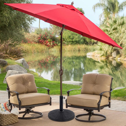 Beefy Heavy Duty 22 Lb Resin Patio Market Umbrella Base Stand with red umbrella on patio with chairs by pond