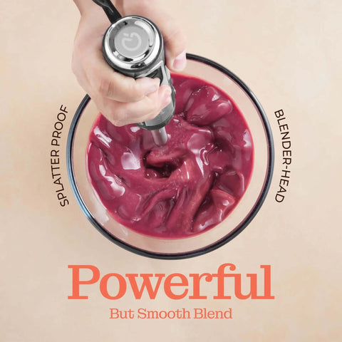 500 Watt Electric Hand Blender With Turbo Boost And Sharp Stainless Steel Blades For Smoothies Soups Purees And Baby Food Detachable Base Grey in action blending colorful ingredients.
