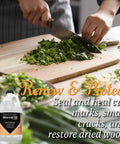 Person chopping greens on wood board with Top Notch Ultrapure Mineral Oil For Cutting Boards And All Wood Care 1 Gallon bottle visible.