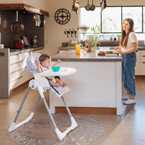 Child in high chair on Waterproof High Chair Floor Mat 50 Inch Diameter Clear Circle Kitchen Mat Protects Floors From Spills And Messes While Your Little One Sits Eats And Learns To Self Feed