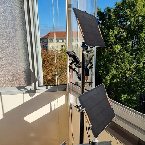 2 Pack USB Solar Panel Kit 6W 5V Monocrystalline Mini Panels With USB 2.0 Port set up on balcony rail under sunlight