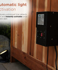 Outdoor 200 Watt Transformer With Photo Cell And Timer For Ponds And Fountains mounted on a wooden fence