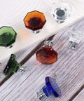 Assorted colored crystal glass knobs with chrome bases on wood surface. Multi-color set not related to product listing.