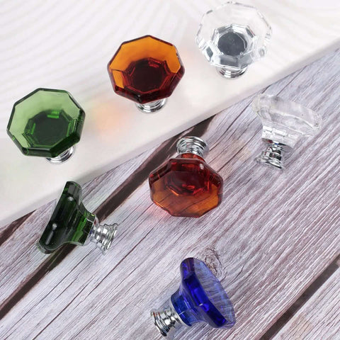 Assorted colored crystal glass knobs with chrome bases on wood surface. Multi-color set not related to product listing.
