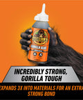 Brown Waterproof Polyurethane Glue 8 Oz Heavy Duty All Purpose Adhesive That Expands Into Materials For A Beastly Ultra Strong Bond On Wood Metal Ceramic And More, held by a hand.