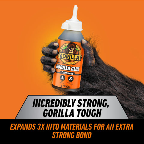 Brown Waterproof Polyurethane Glue 8 Oz Heavy Duty All Purpose Adhesive That Expands Into Materials For A Beastly Ultra Strong Bond On Wood Metal Ceramic And More, held by a hand.