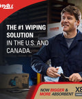 Man holding PowerClean X80 cloth in industrial setting, text reading '#1 wiping solution', box of wipes visible.