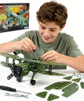 Boy assembling Metal Plane Toy Buildable Fighter Jet Kit For Kids And Teens With Propeller Double Wing Cockpit And Tailplane