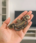 Vintage Look Bail Drawer Pull 2.5 Inch Center To Center Dark Antique Bronze Cabinet Handle shown in hand
