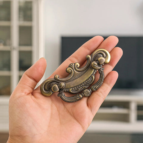 Vintage Look Bail Drawer Pull 2.5 Inch Center To Center Dark Antique Bronze Cabinet Handle shown in hand